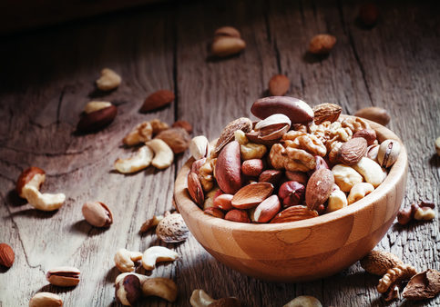 Set of different nuts, useful healthy food, vintage wooden background, selective focus